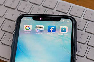 Paris, France - February, 20, 2020 : Mobile phone displaying the Gafa site  : GAFA apps and icons on an iPhone. Google, Amazon, Fa