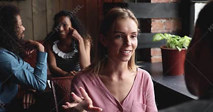 Smiling young woman attending speed blind date.