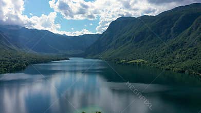 Aerial view of Bohinj lake in Julian Alps. Popular touristic destination in Slovenia. Bohinj Lake, Church of St John the Baptist.