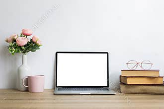 Mock up with books, coffee and pink roses flower on wooden table.