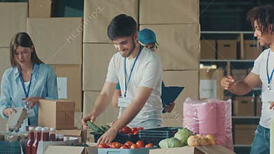 Charity, Donation, and Volunteering Concept - Group of Happy Smiling Volunteers