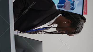 Vertical video: Receptionist helping patients with checkup forms