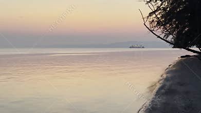 Beautiful shot of waves washing the shore during a scenic sunset in Tacoma