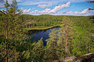 View from Hauklamminvuori Hill to the Hauklampi lake, rocks and forest in the Repovesi National Park