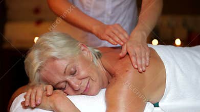 Senior Woman Having Massage In Spa