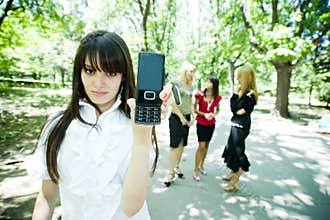 Teen displaying cell phone