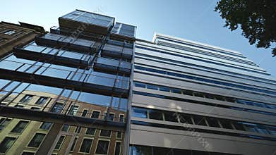 Business company headquarter with glass facade in downtown of Hamburg Germany