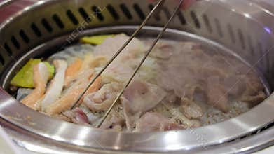 Grilling meal. Korean-style barbecue, where diners grill thinly sliced meat