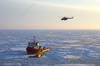 Ship and helicopter in the Arctic