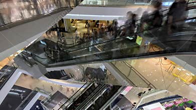 Time Lapse of People Traffic Moving on Retail Mall Escalators to Shopping Stores