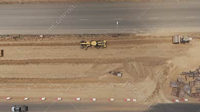 Aerial view drone footage of bridge construction being made across the intersection