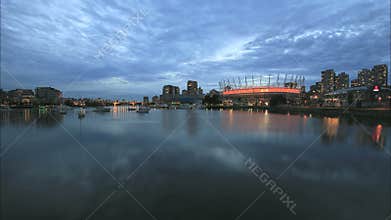 Vancouver BC Canada with Scenic View of Office Condominium Buildings Clouds and Moving Boats along False Creek