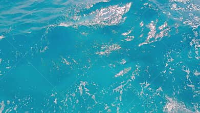 The video showcases a serene pool view and crashing ocean waves