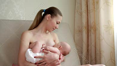 Lactation.Mother breastfeeds her baby
