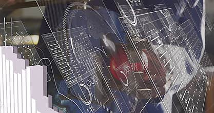 Male technician gripping lever and tightening vise monitoring graphs during factory calibration