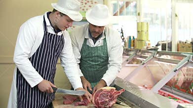 Butcher Teaching Apprentice How To Prepare Meat