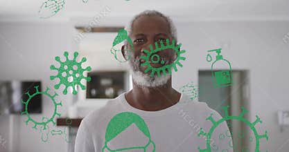 Mature man standing home experiencing swirling green health icons guiding him into smiling face
