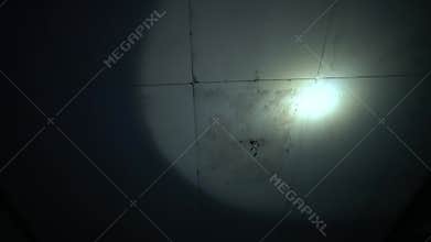 Eerie Spotlight on Ceiling with Stains