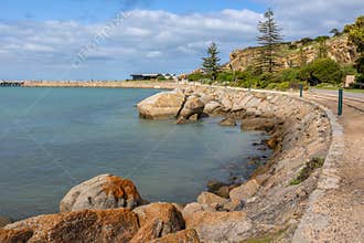 A causeway with sea and granite boulders joining Granite Island to the mainland