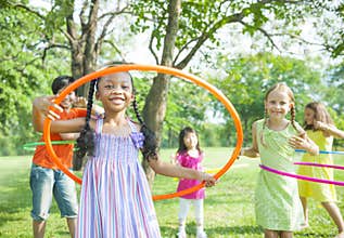 Children Playing With Hoola Hoops