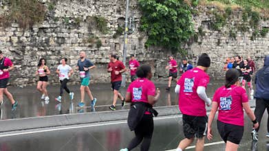 Athletes running Istanbul half marathon in historic street of Fener district