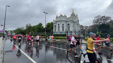 Athletes running Istanbul half marathon in historic street of Fener district