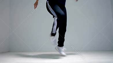 Woman\'s lower legs and feet doing jump rope exercise workout indoors cardio stock footage Generative AI