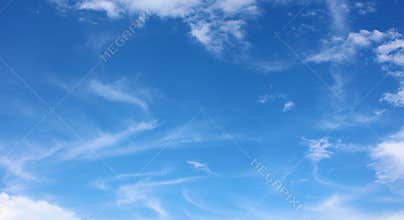 Soft white clouds against blue sky