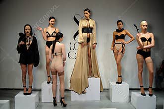 NEW YORK, NY - OCTOBER 25: Models pose during Love Cage Spring 2015 lingerie presentation