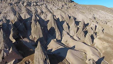 Aerial drone view of Cappadocia fairy chimneys and sculpted volcanic valleys in Turkiye, rock formations, badlands, volcanic tuff