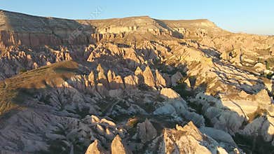 Aerial drone view of Cappadocia fairy chimneys and sculpted volcanic valleys in Turkiye, rock formations, badlands, volcanic tuff