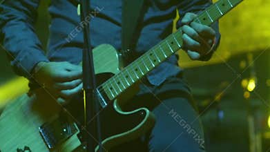 Guitarist playing guitar at open air rock festival