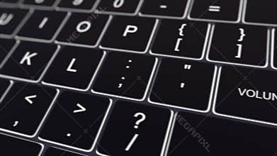 Dolly shot of black computer keyboard and glowing volunteer key. Conceptual 4K clip