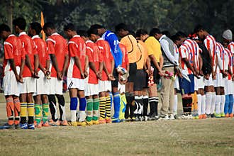 Players are taking part in a condolence ceremony just before the beginning of the game.