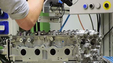 Worker assemble an engine