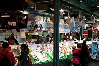 SEATTLE, WASHINGTON, USA - JAN 24th, 2017: Customers at Pike Place Fish Company wait to order fish at the famous seafood