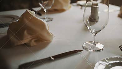 Dolly shot close up beautifully served expensive tableware warm tones