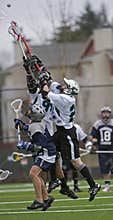 Boys Lacrosse climbing for the ball