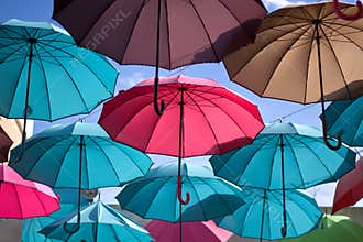 The flight of colored umbrellas