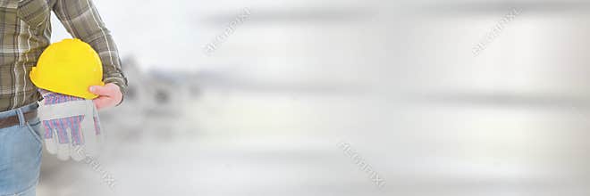 Construction Worker with safety helmet in front of construction site with transition effect