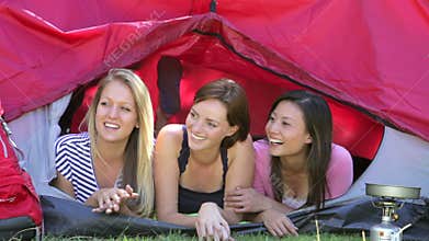 Three Young Women On Camping Holiday Together