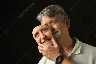 Bipolar disorder depressed man with mask