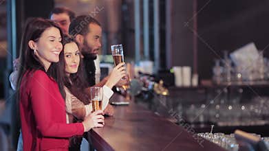 Group of girls and boys at the bar