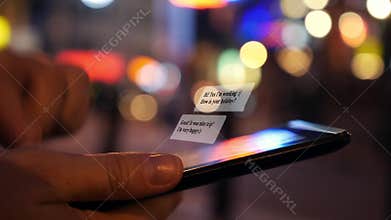 Chatting SMS on Tablet Computer at Night City