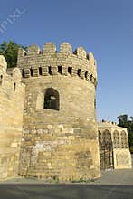 Ancient fortress wall with watchtower in Baku old town