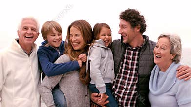 Family standing and laughing