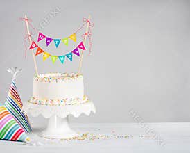 White Birthday Cake colorful bunting