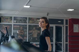 The sports girl on a treadmill