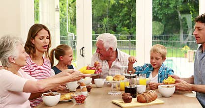 Happy family having breakfast together