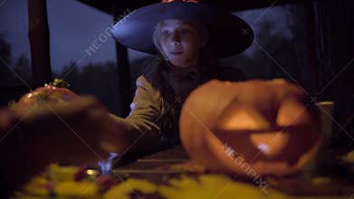 Two teen girls sharing candys after trick or treat on Halloween night